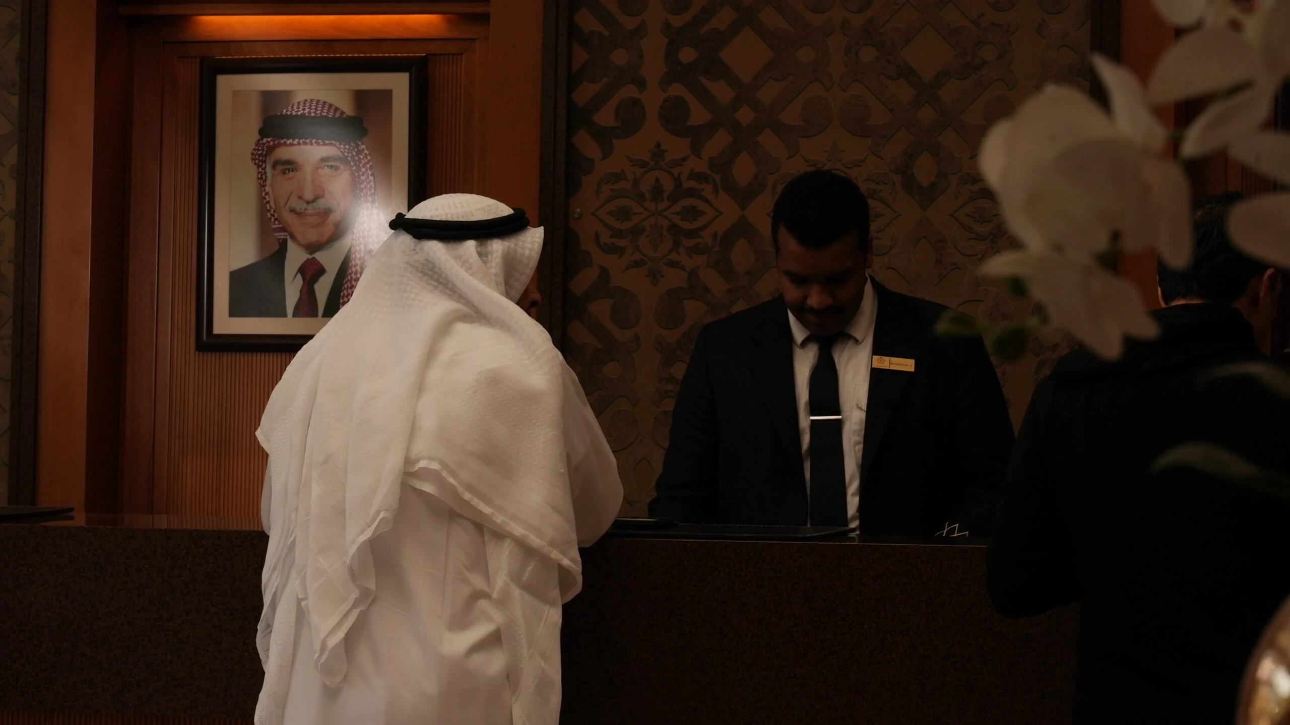 Guest being welcomed at the Thousand Nights Hotel front desk